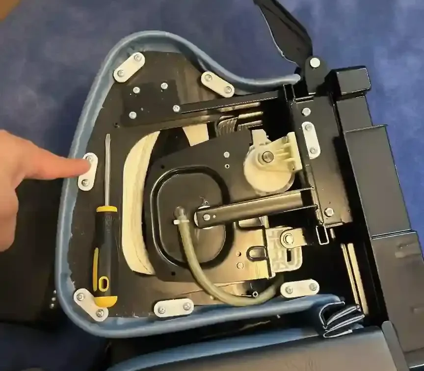 Professional repair of a luxury blue massage chair in a Boston, MA home by Ergo Setup Boston.